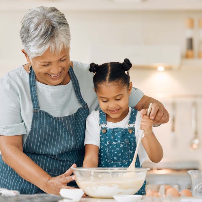 grandmother-and-grandaughter-baking-in-kitchen